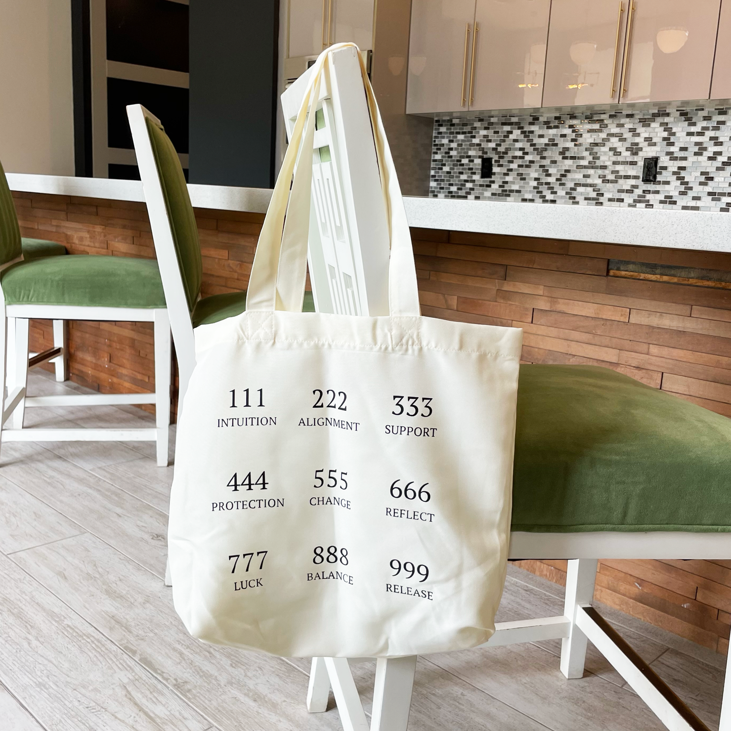 angel number tote black hanging from a chair