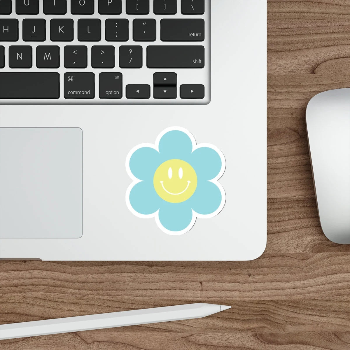 blue and yellow smiley face flower on laptop