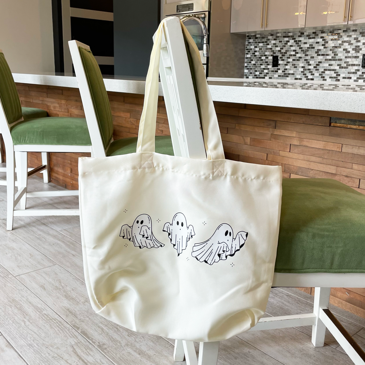 tote bag with dancing ghosts hanging from a chair