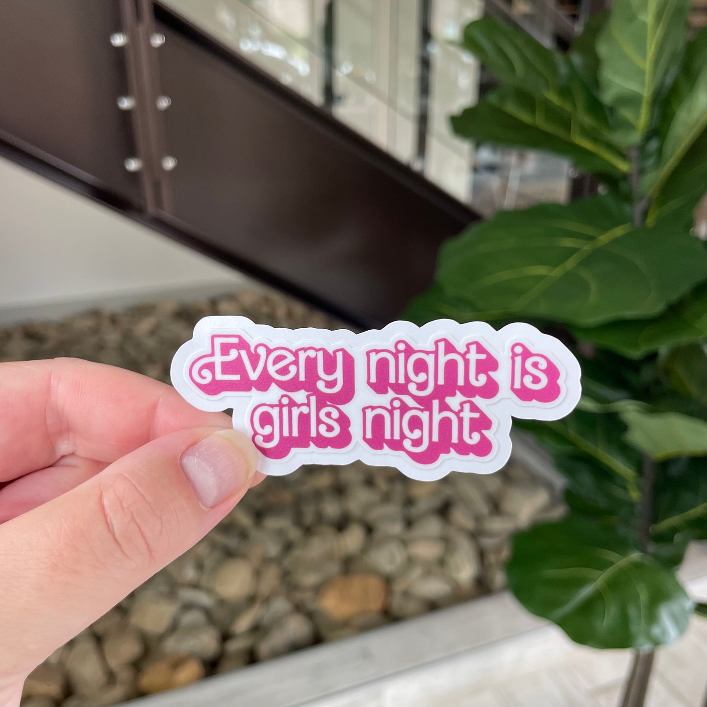 sticker in pink barbie-like font that says "every night is girls night"