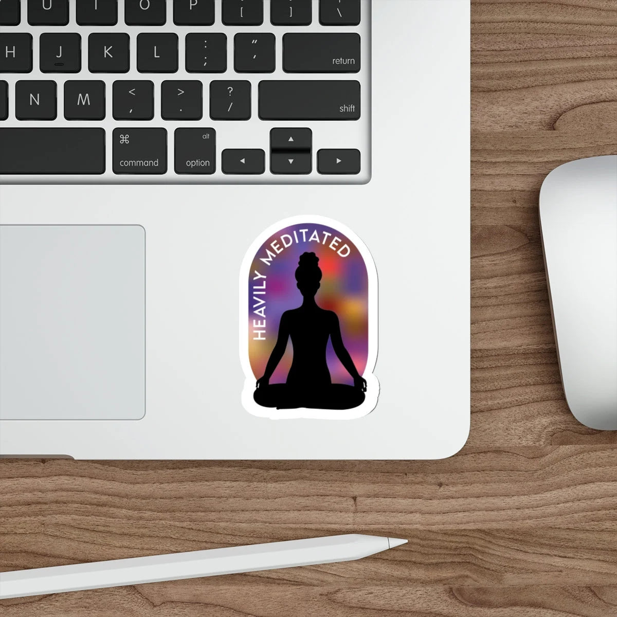 Silhouette of meditating woman with aura around her on laptop