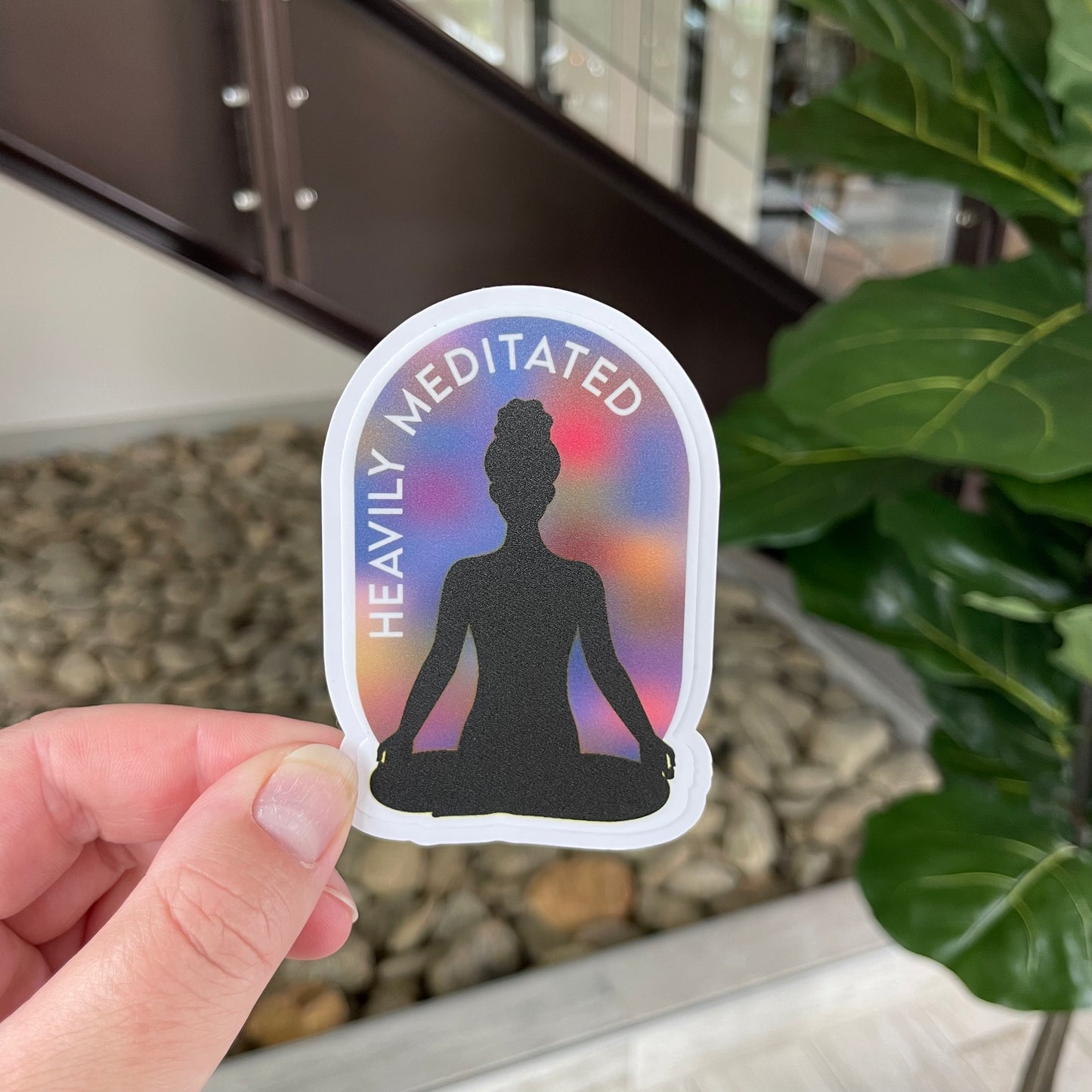 woman meditating with aura around her that says heavily meditated