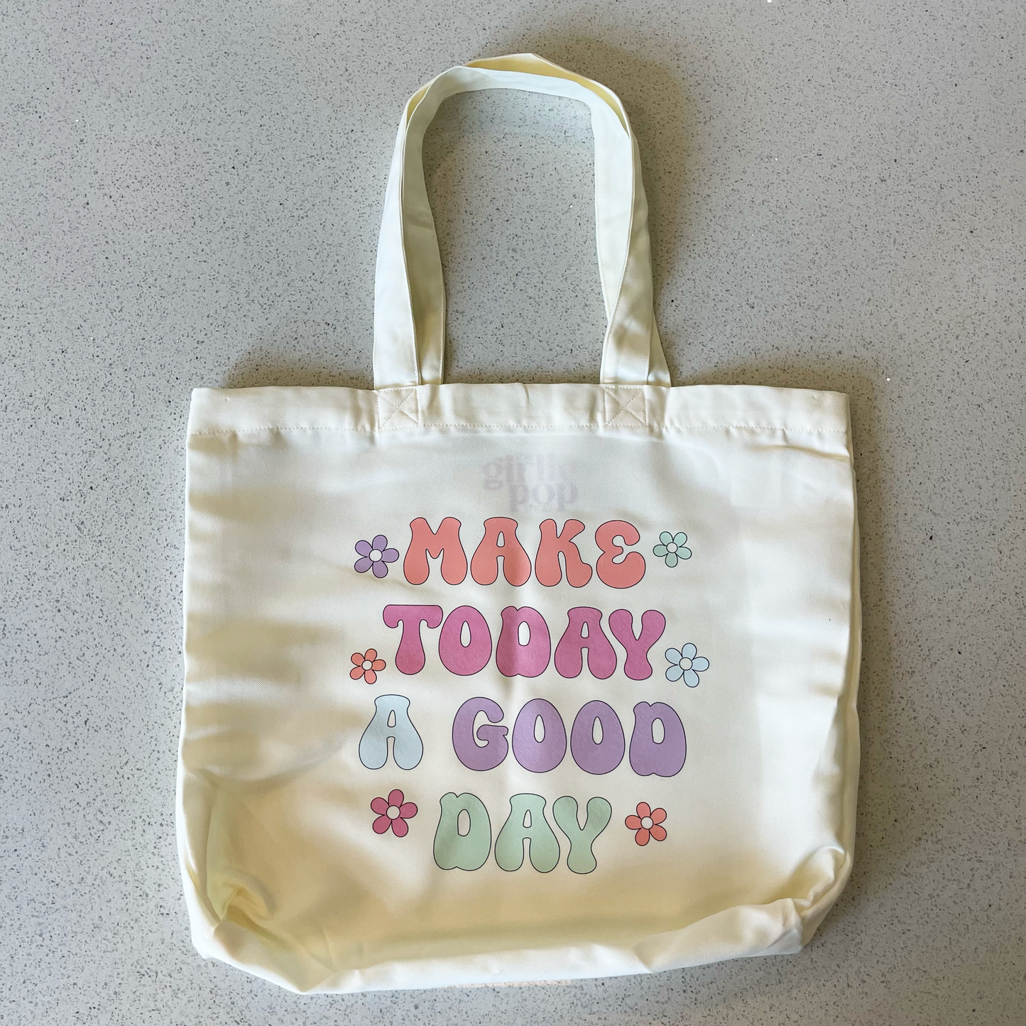 tote bag that says make today a good day in pastel colors