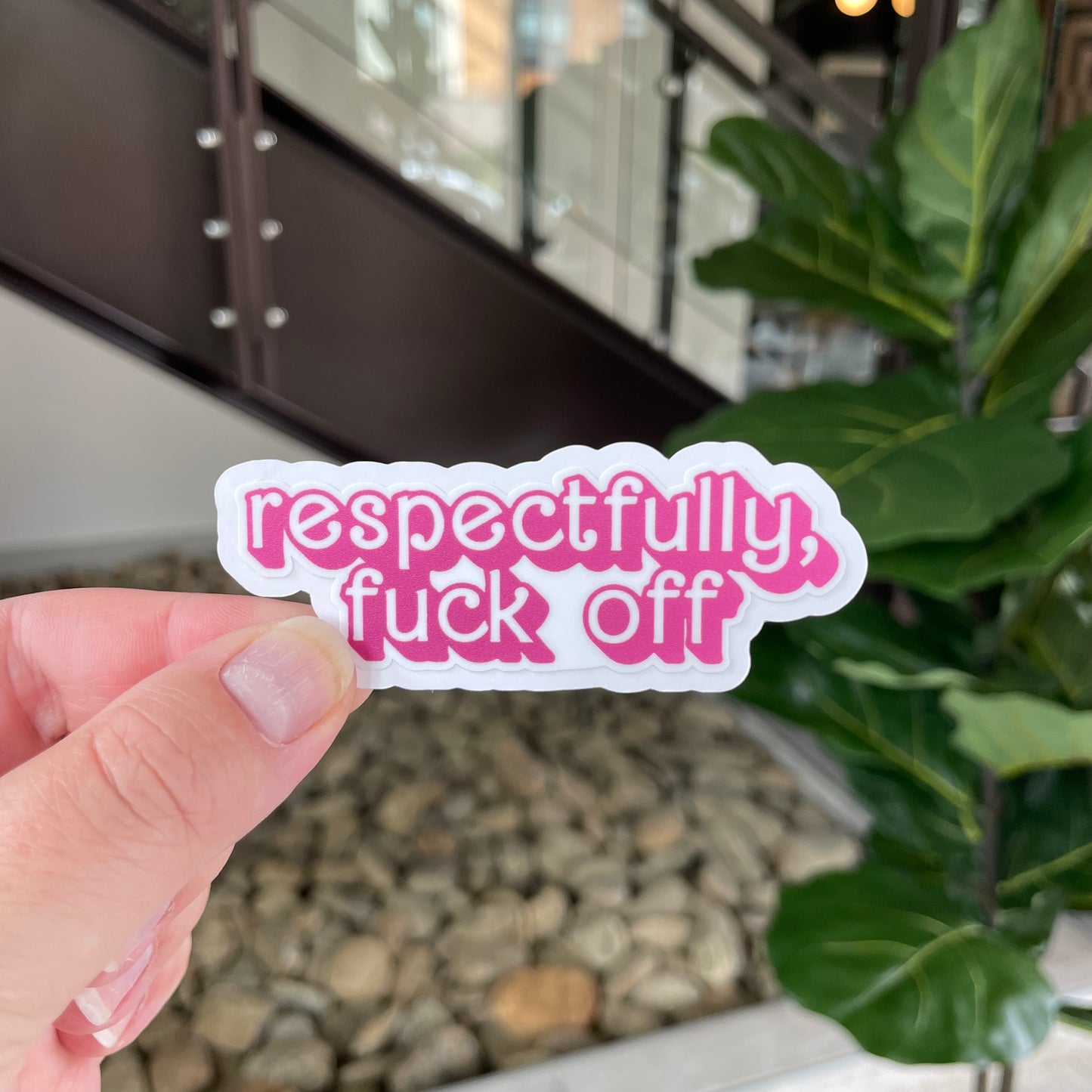 sticker in pink barbie-like font that says "respectfully, fuck off"