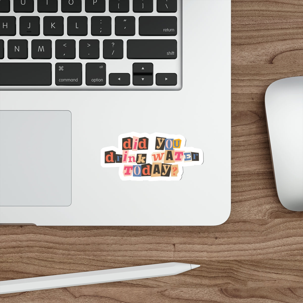 magazine letter cutouts of different colors saying did you drink water today on a sticker that's on a laptop