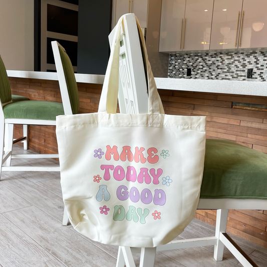 tote bag that says make today a good day hanging from a chair