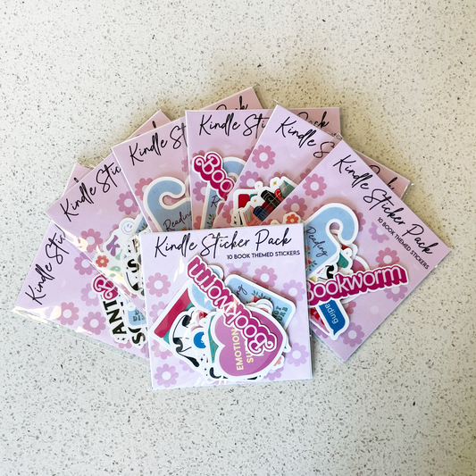 7 kindle sticker packs fanned out on a table
